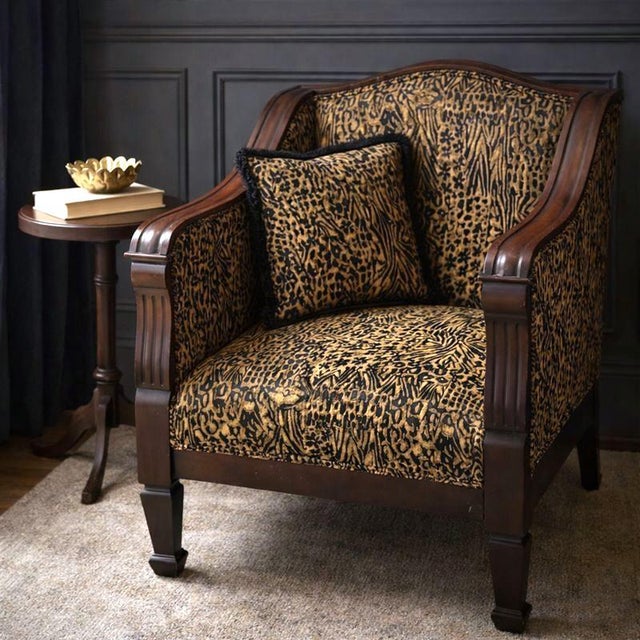 This American Empire–style mahogany club chair pairs a classic, architectural silhouette with bold custom animal-print...