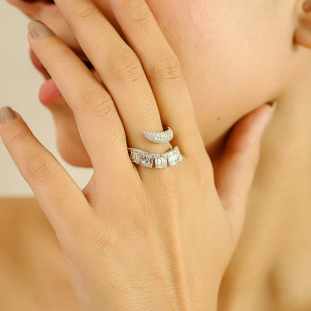 Bold yet refined, this contemporary bypass ring is masterfully crafted in 14k white gold and adorned with 1.07 carats of...