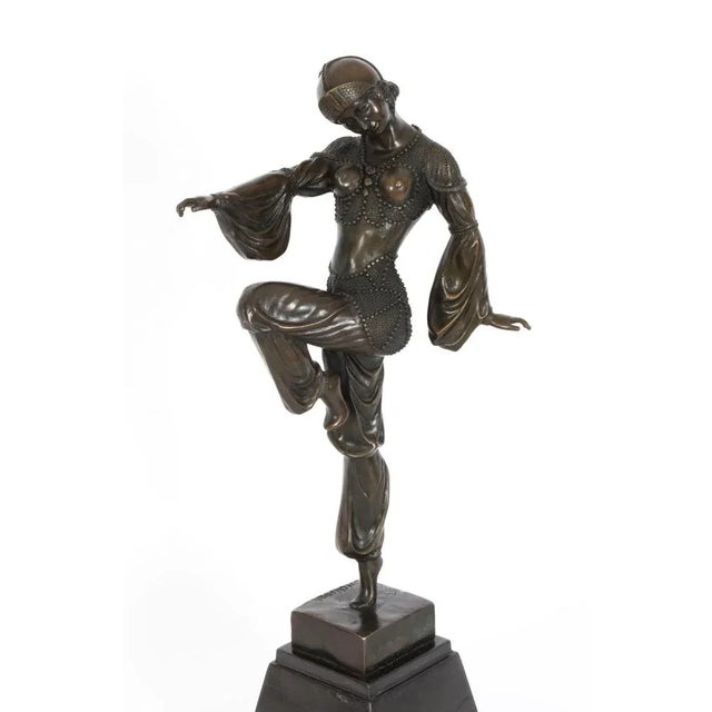 This is an eye-catching Vintage Art Deco Revival bronze dancing girl dating from the mid 20th century. This beautiful...