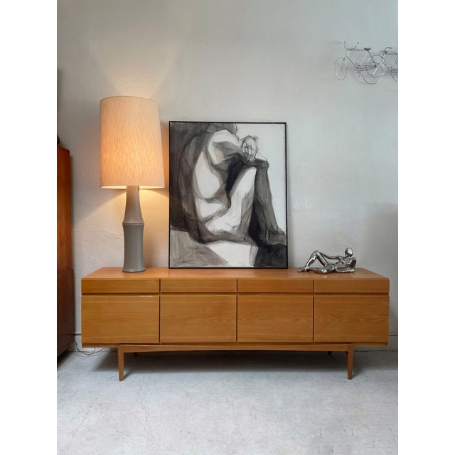 Large oak sideboard, model FA66, designed by Ib Kofod-Larsen and produced by Faarup Møbelfabrik in the 1960s. The...