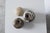 The set includes three ceramic objects: two perforated “Mushroom”-style vases by Erik Græser and a separate, enclosed...