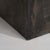 A bold French Brutalist table featuring an octagonal slate stone top supported by a strong iron base, emphasizing raw...