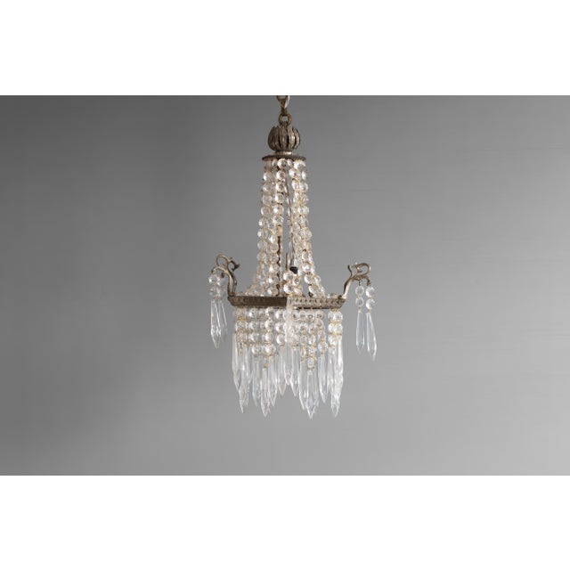 Small sized bag style chandelier. Re-wired and tested. Circa 1900. Up to 250V (Europe/UK Standard).The wiring of this item...
