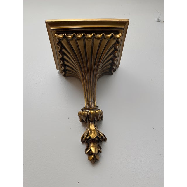 Bring classical architectural charm to your walls with this vintage Hollywood Regency display shelf featuring a rich...