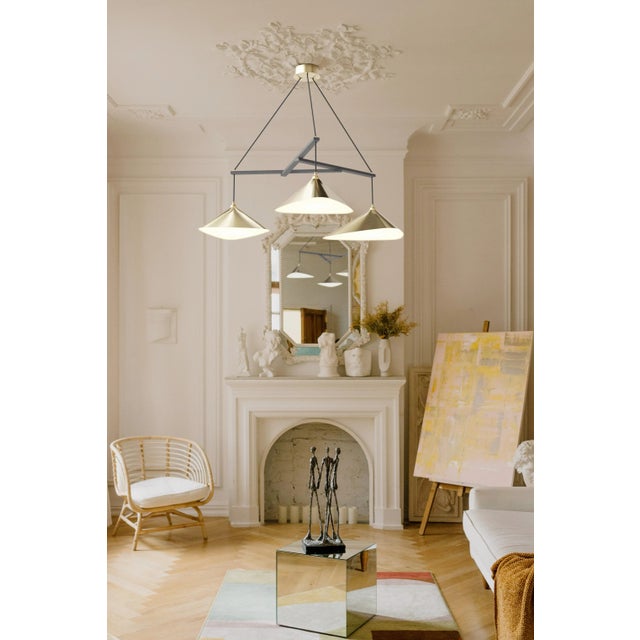 Daniel Becker 'Emily 3' chandelier in brass with oak frame for Moss Objects. Designed by Berlin luminary Daniel Becker and...