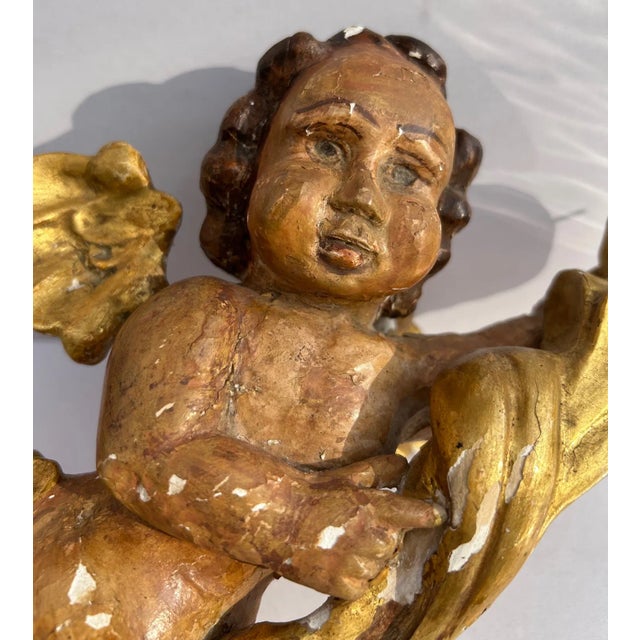 Spanish Painted and Gilt Wood Putty with Torchiere, late 19th, early 20th century. H. 11 in. x W. 5.5 in.