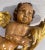 Spanish Painted and Gilt Wood Putty with Torchiere, late 19th, early 20th century. H. 11 in. x W. 5.5 in.