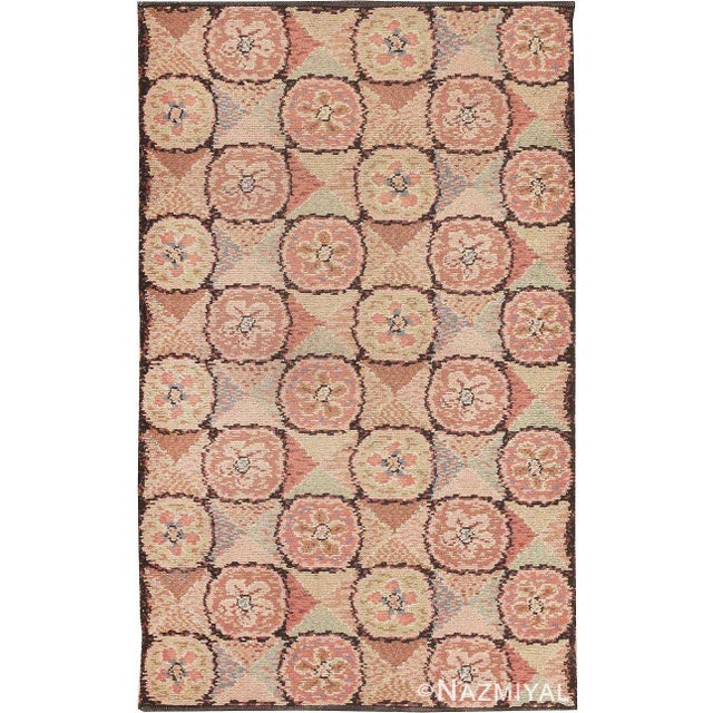 This charming little vintage Arts and Crafts rug from Europe has a multi-colored reciprocal pattern of circles and concave...