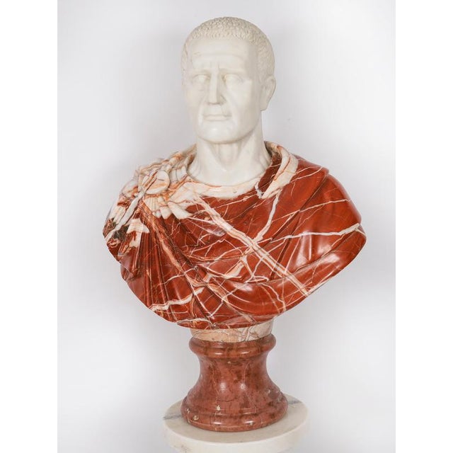 A life size carved marble bust of Roman Emperor Otho (69 AD) on a marble doric column, mid 20th century in date. The face...