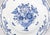 A lovely antique 18th-Century Dutch Delft faience plate with a hand painted floral arrangement in a cherub vase in classic...