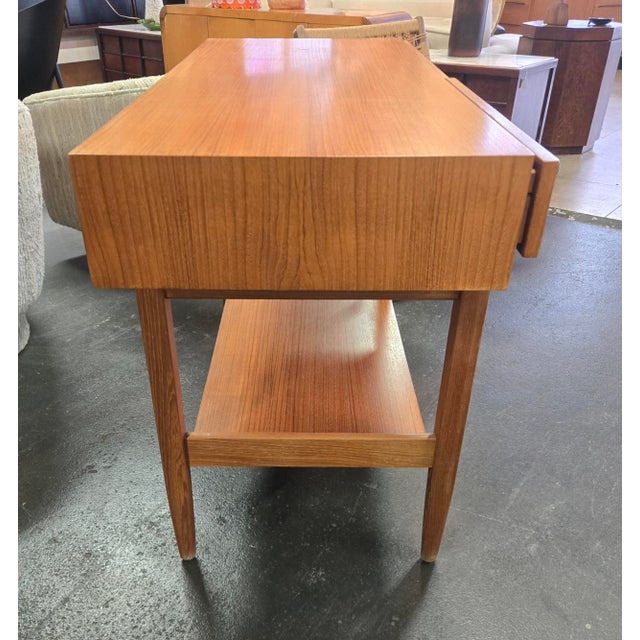 Beautiful wood console features clean lines and simple design inspired by Danish designer Kofod Larson and manufactured by...