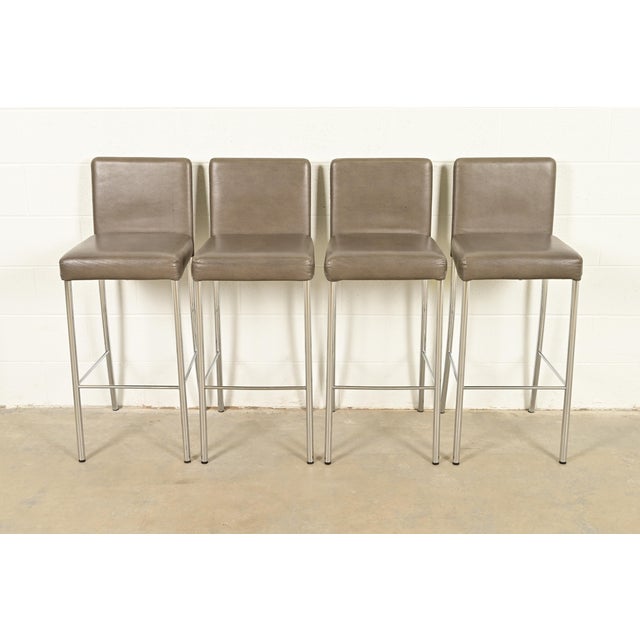 A gorgeous set of four contemporary or Modern "Switch" bar stools By Coalesse for Steelcase USA, 2010 Leather upholstered...