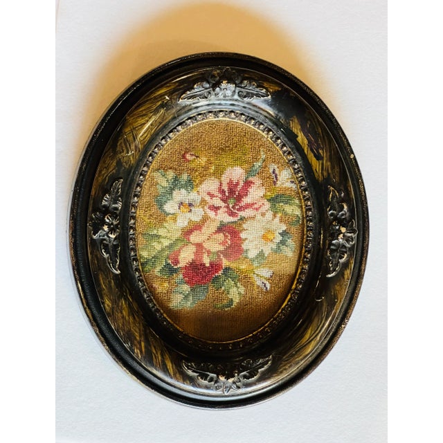 Delicate wool needlepoint in what appears to be a smaller stitch- petit point. The colors are still bright and vivid....