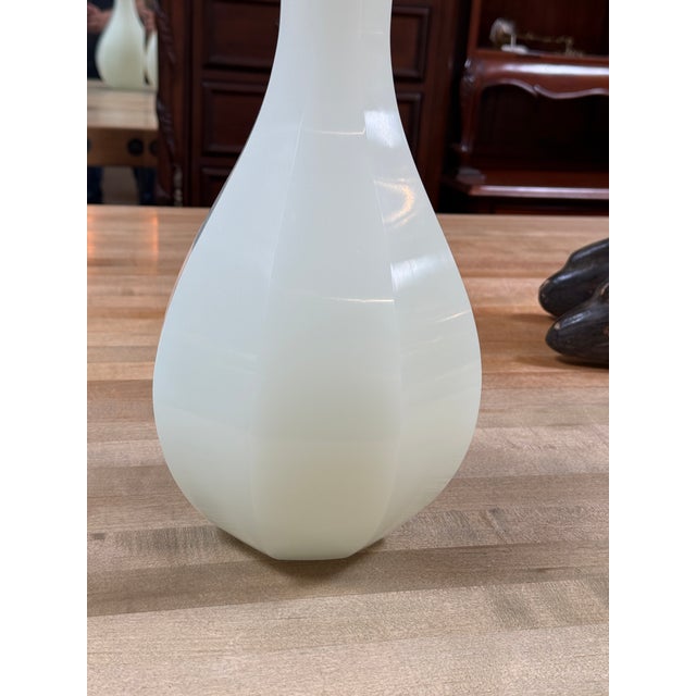 Design Plus Gallery presents the Baljade Beveled Vase from Baker. This sculptural vase has a milky white translucent body...