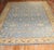 Large Antique Turkish Oushak rug in blue and mustard from the 1930s