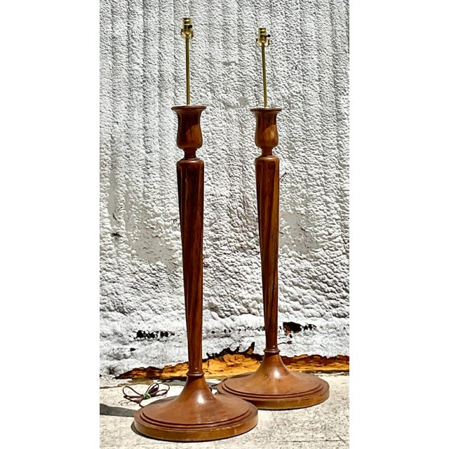 A fabulous pair of vintage Regency wood floor lamps. Beautiful classic candlestick design. Fully restored with all new...