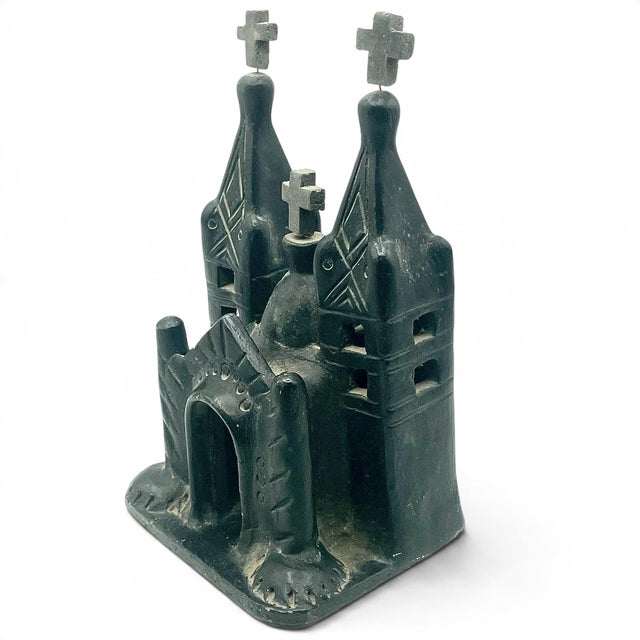 One Mexican folk art sculpture representing a church building. Crafted from Oaxacan barro negro, a black clay pottery...