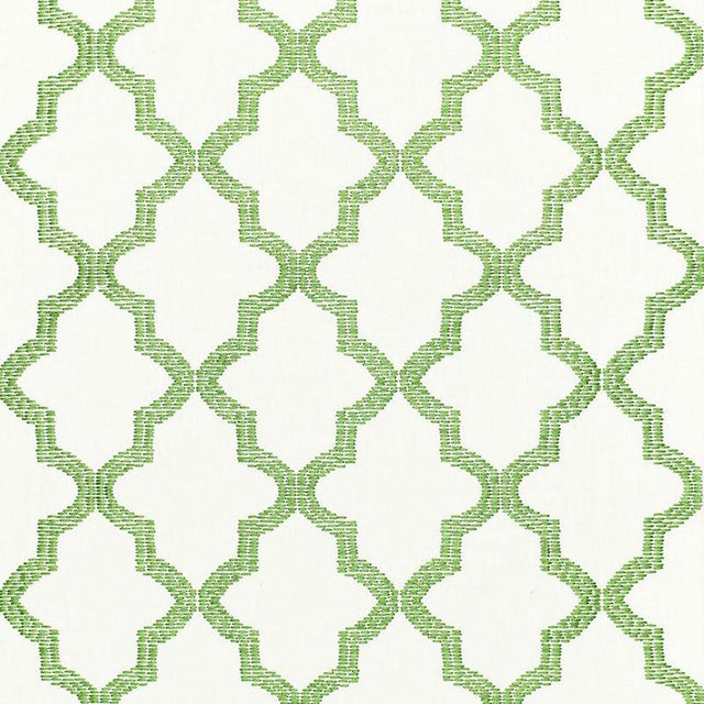 Mod meets Moroccan in this geometric pattern. A fretwork motif embroidered in thick rayon yarn adds dimension and sheen....