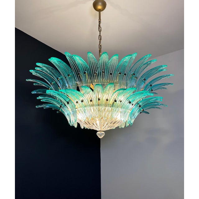 Luxury and genuine murano glass chandelier. Hand made in murano. It made by 82 murano turquoise glasses, two levels, in a...