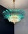 Luxury and genuine murano glass chandelier. Hand made in murano. It made by 82 murano turquoise glasses, two levels, in a...