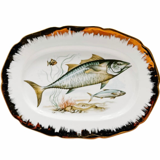 Elevate your next coastal or lakeside gathering with this 7-piece vintage porcelain fish service set. Sourced from an...