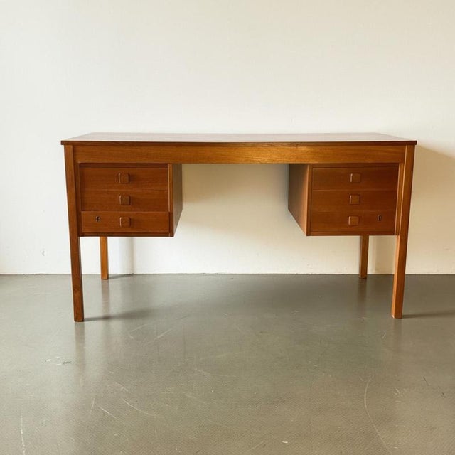 midcentury double pedestal teak desk. In good vintage condition. Approximate dimensions: width: 134.5cm depth: 59cm...