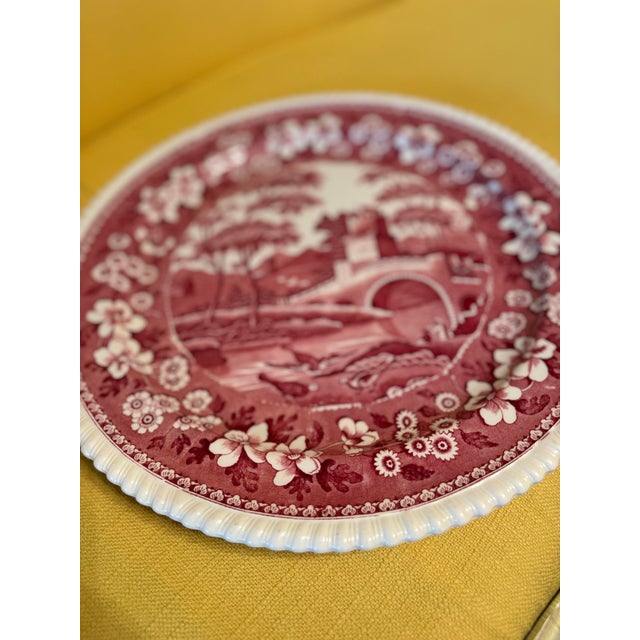 Large-scale late 19th-century English round plate by Copeland Spode, decorated in a rich red scenic transferware pattern....