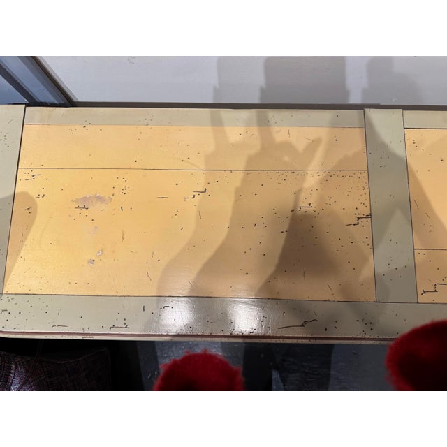 This is a vintage console table that has been made of recycled pine. It has two drawers. The drawers have decorative...