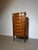 Elegant Louis XV style tall chest of drawers, featuring decorative floral marquetry, brass ormolu mounts and a beautifully...