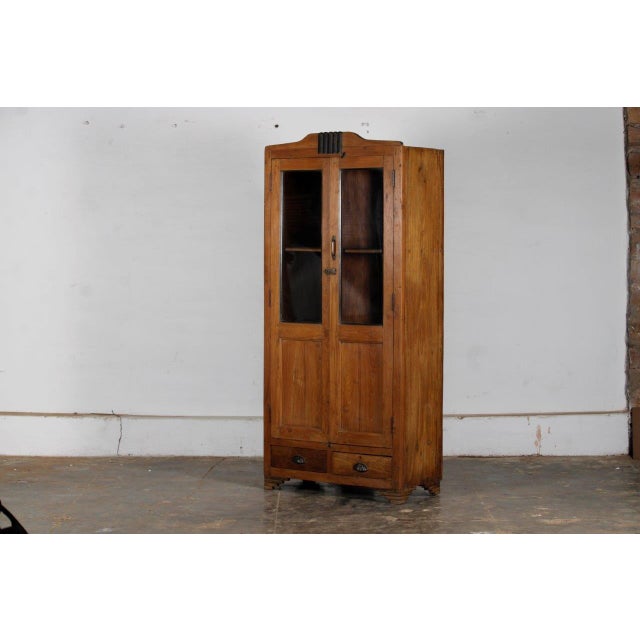 Vintage Indian Teakwood Bookcase, a very sweet piece of fruitwood colored teak. In the Deco style, mid-20th century, with...