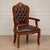 Add timeless sophistication to your interior with this elegant French-style armchair. Crafted from solid wood and...