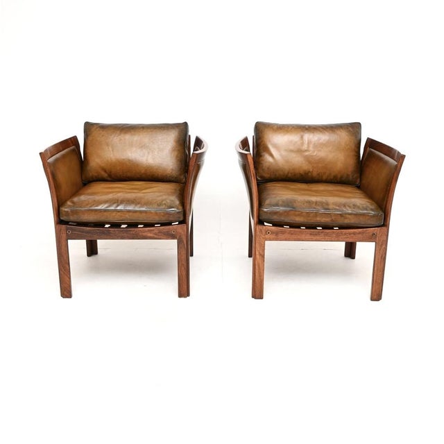 A stylish and very rare pair of vintage Danish armchairs by Illum Wikkelso. This model is called the ‘Plexus’ armchair, it...