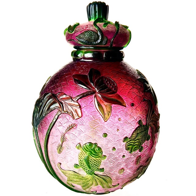 An exquisite hand made Peking cameo glass jar, having two layers of glass: green over pink, the green layer has been...