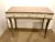 Timeless Caracole Modern Taupe and Ivory Wood Vanity Desk, taupe wood frame and top, three fluted ivory finished drawers,...