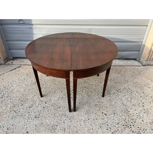 Antique Federal Satinwood Inlaid Mahogany Demilune Consoler Tables. Circa 1850s. Distinctive pair of mahogany demi-lune...