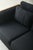 Rare vintage three seat sofa defined by its sculptural ribbed wood arms and black upholstery. Subtle pinstriped back...