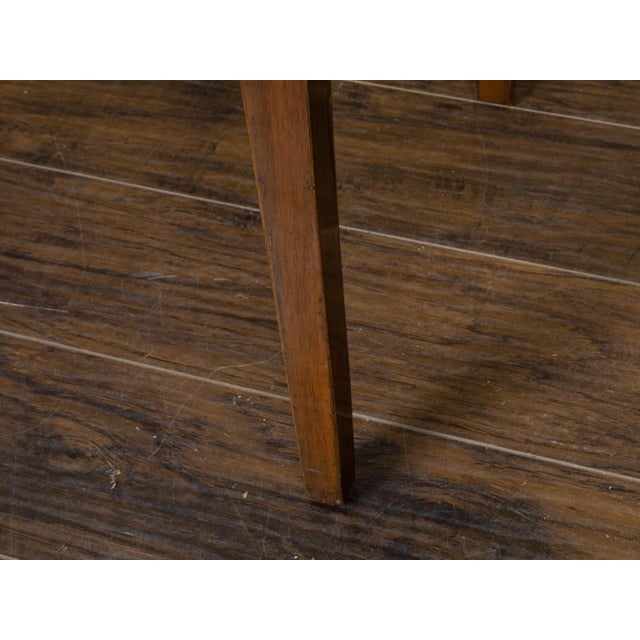 A French walnut side table from the 19th century, with quarter veneered top, protruding rounded corners, single drawer and...