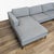 Features a modern design with wide arms, plush loose cushions, and distinctive angular powder-coated steel legs. Brand Blu...