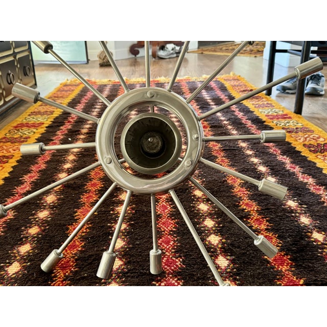 Very cool authentic 1950s/60s Sputnik ceiling fixture with 16 arms and a center pierced metal downlight shade. More of an...