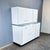 A fully restored kitchen unit, originally made in germany, featuring beautiful contrasts of matte white, a black base, and...