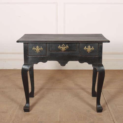 Early 19th century English painted oak low boy. 1830. This piece is designed in the style of the selected designer and/or...