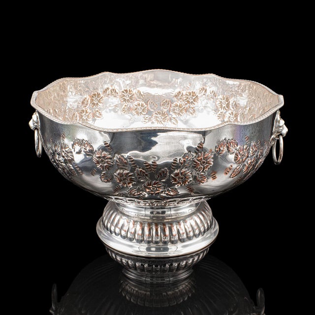 This is a vintage punch bowl. An English, silver plate on copper ice dish or cooler, dating to the Art Deco period, circa...