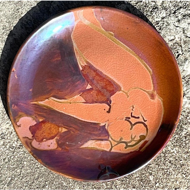 This vintage Boho hand-painted studio pottery plate features a striking nude design, blending artistic flair with a touch...