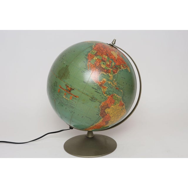 Replogle Library Globe composed of a paper over plastic 12" orb with ocean finishes in an attractive aqua with bold accent...