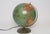 Replogle Library Globe composed of a paper over plastic 12" orb with ocean finishes in an attractive aqua with bold accent...