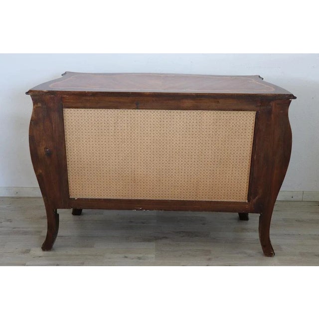 Beautiful large chest of drawers, 1930s. The fine rosewood inlaid wood. Refined and rich inlay work of floral taste on...