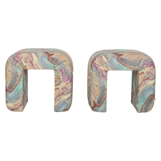 A pair of glamorous Postmodern 1980's Karl Springer-style waterfall benches. The well-constructed benches are upholstered...