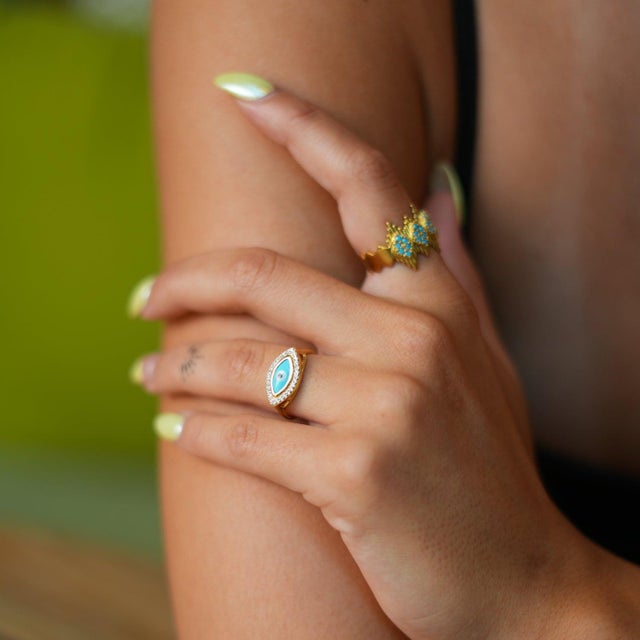 Embrace elegance and spiritual protection with the Turquoise Evil Eye & Diamond Gold Statement Ring . Crafted with an 18k...