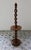 Antique turned wooden lamp base with twisted decoration, featuring an integrated circular shelf, in an elegant French...
