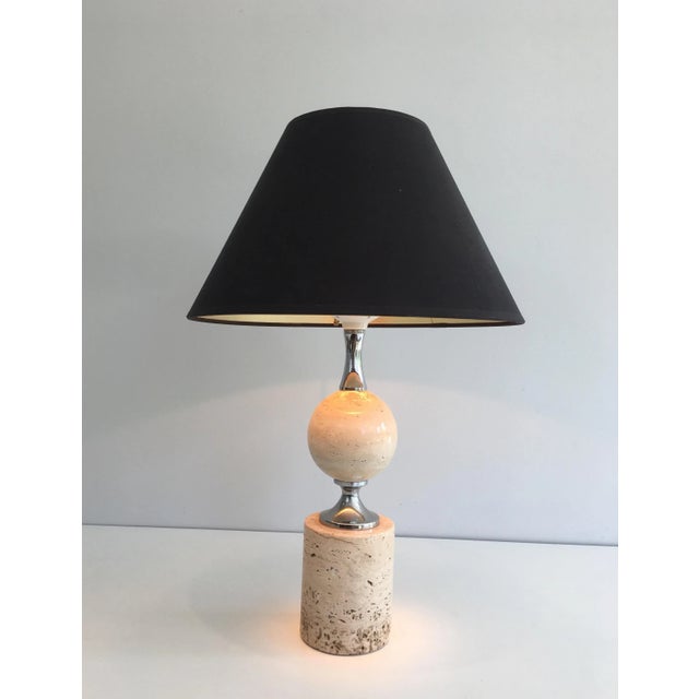 This nice table lamp is made of travertine and chrome. This is a work by famous French designer Philippe Barbier, circa...